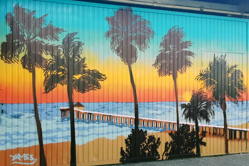 Landscape painting with a beach motif on a metal door in Altenkirchen, Germany